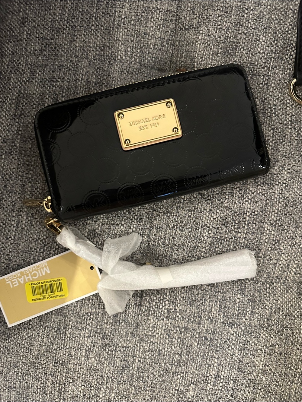 Michael Kors Black Patent Zip Wristlet with Gold Plaque